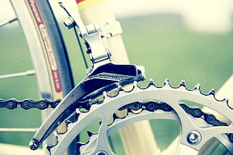 Close-up of bicycle chain, gears, and derailleur mechanism