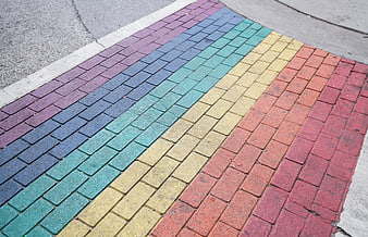 Rainbow painted brick sidewalk crosswalk pattern