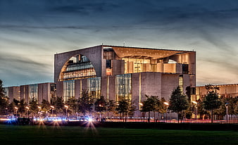 Modern concrete architecture at dusk with light trails
