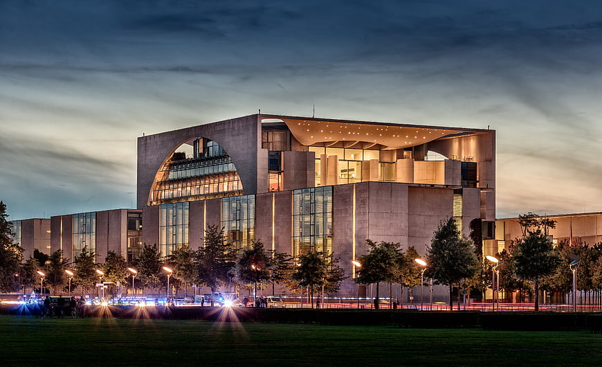 Modern concrete architecture at dusk with light trails