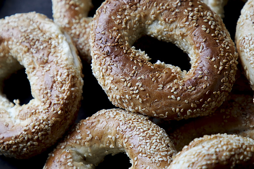 Close-up of Fresh Sesame Bagels Piled Together