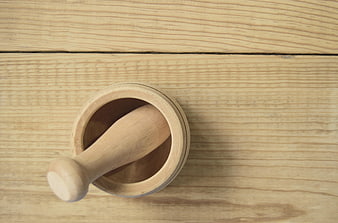 Wooden Mortar and Pestle on Light Wood Table