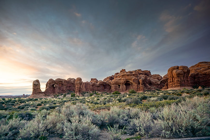 Dramatic Sunset Landscape of Red Rock Formations in Desert
