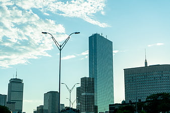 Modern City Skyline with Skyscrapers and Street Lamps