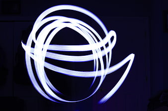 Abstract Blue Light Painting Swirls on Dark Background