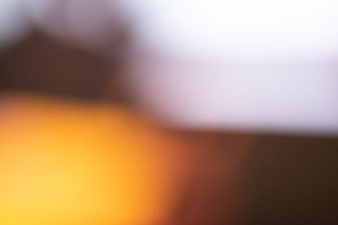 Abstract Blurred Background with Warm Orange and White Tones