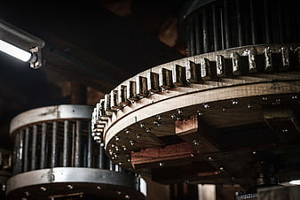 Close-up of large wooden industrial gear mechanism