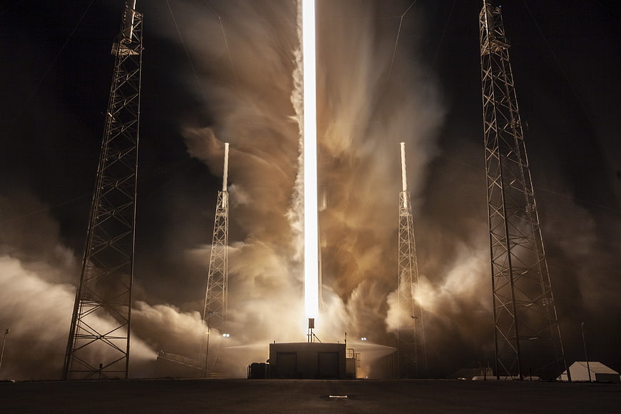 Rocket Launch at Night with Intense Flame and Smoke