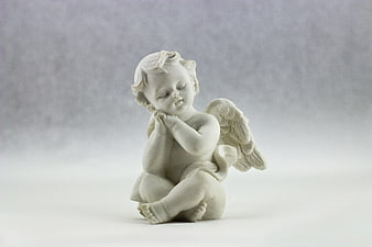 White Ceramic Angel Figurine in Prayer Pose