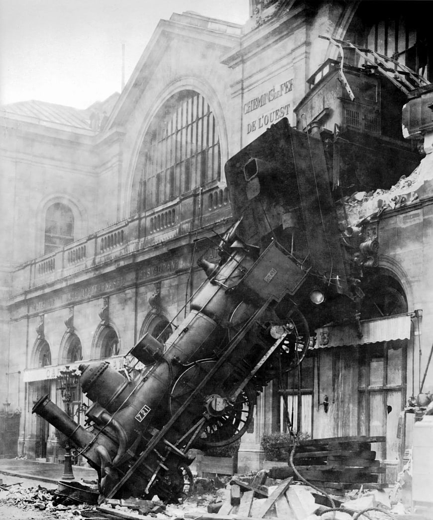 Historic Black and White Photo of Steam Train Crashed into Building