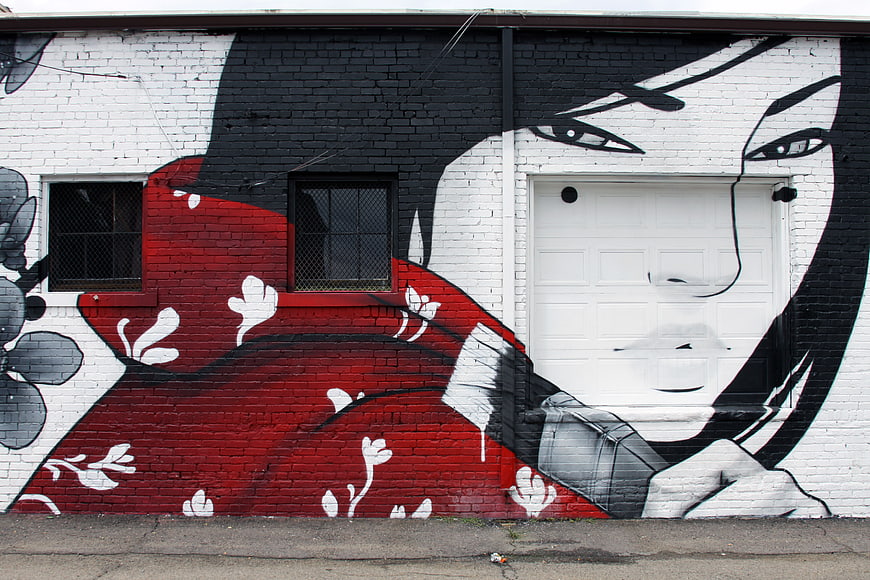 Large scale street art mural of woman in red kimono