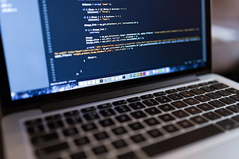 Laptop Screen Displaying PHP Code