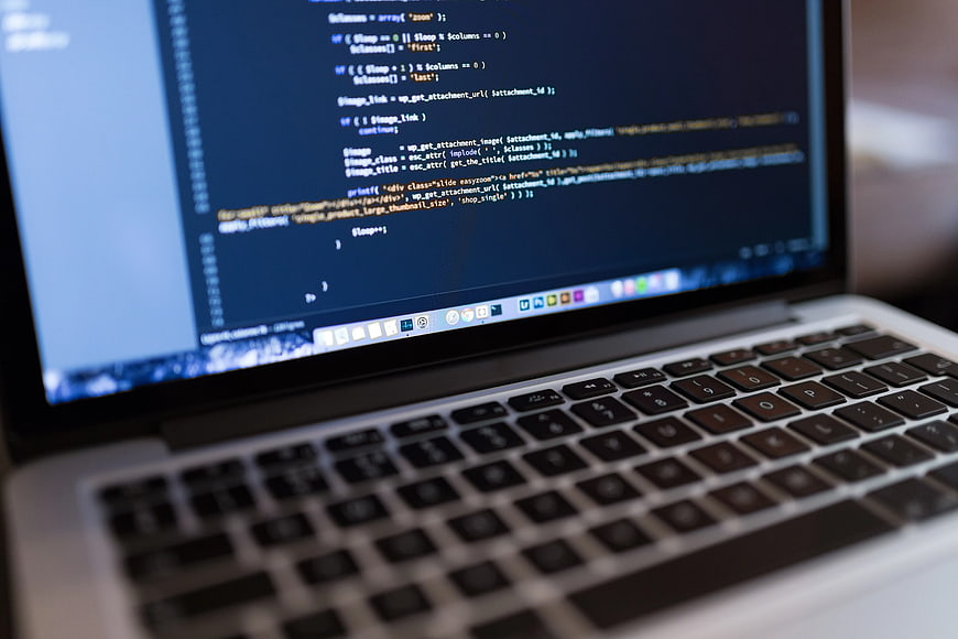 Laptop Screen Displaying PHP Code