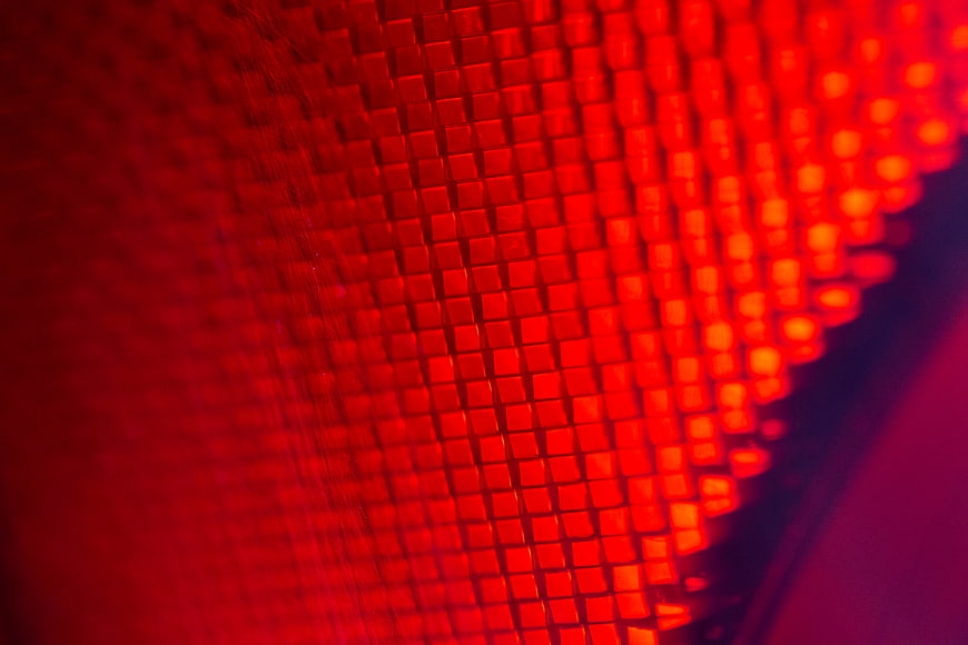 Abstract Macro Close-Up of Glowing Red LED Grid Texture