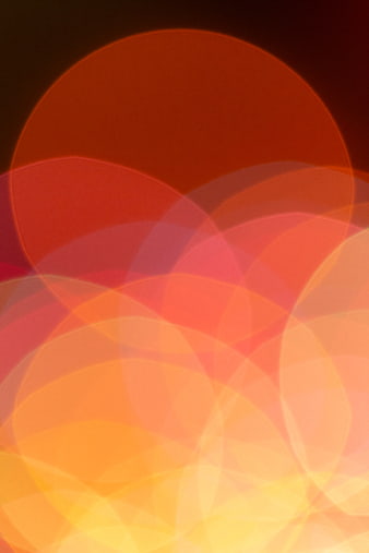 Abstract Bokeh Background with Warm Red, Orange, and Yellow Lights