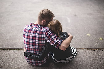 Couple Hugging on Pavement from High Angle