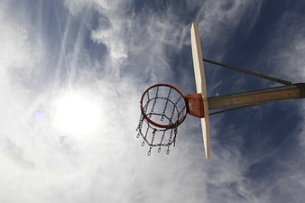 Low angle view of basketball hoop against blue sky
