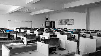 Empty Computer Lab with Monitors and Headsets
