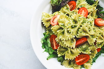 Top View of Pesto Pasta Salad with Cherry Tomatoes