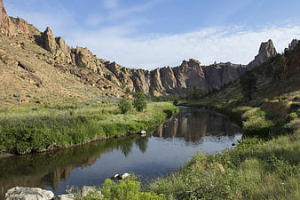 Scenic river winding through rocky mountain canyon landscape