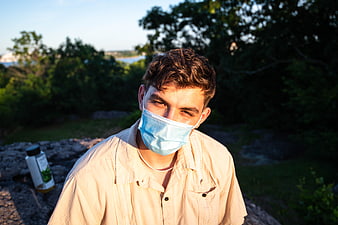 Young Man Wearing Face Mask Outdoors in Nature