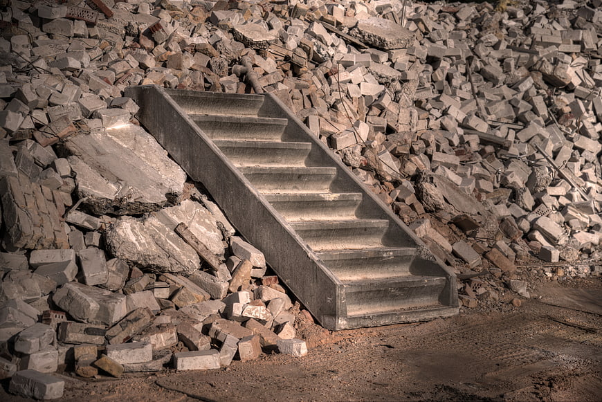 Concrete Staircase Amidst Construction Rubble and Debris