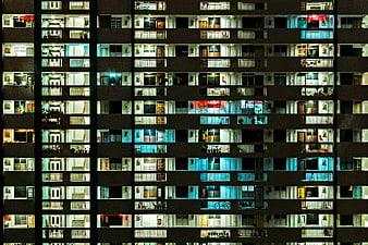 Night view of illuminated apartment building balconies