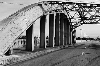 Black and white photo of steel truss bridge architecture
