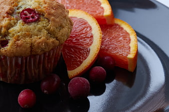 Cranberry Muffin with Grapefruit Slices on Dark Plate