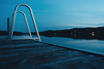 Metal Dock Ladder on Wooden Pier at Blue Hour