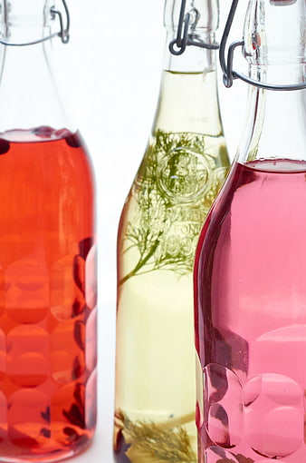 Colorful Infused Spirits in Glass Bottles