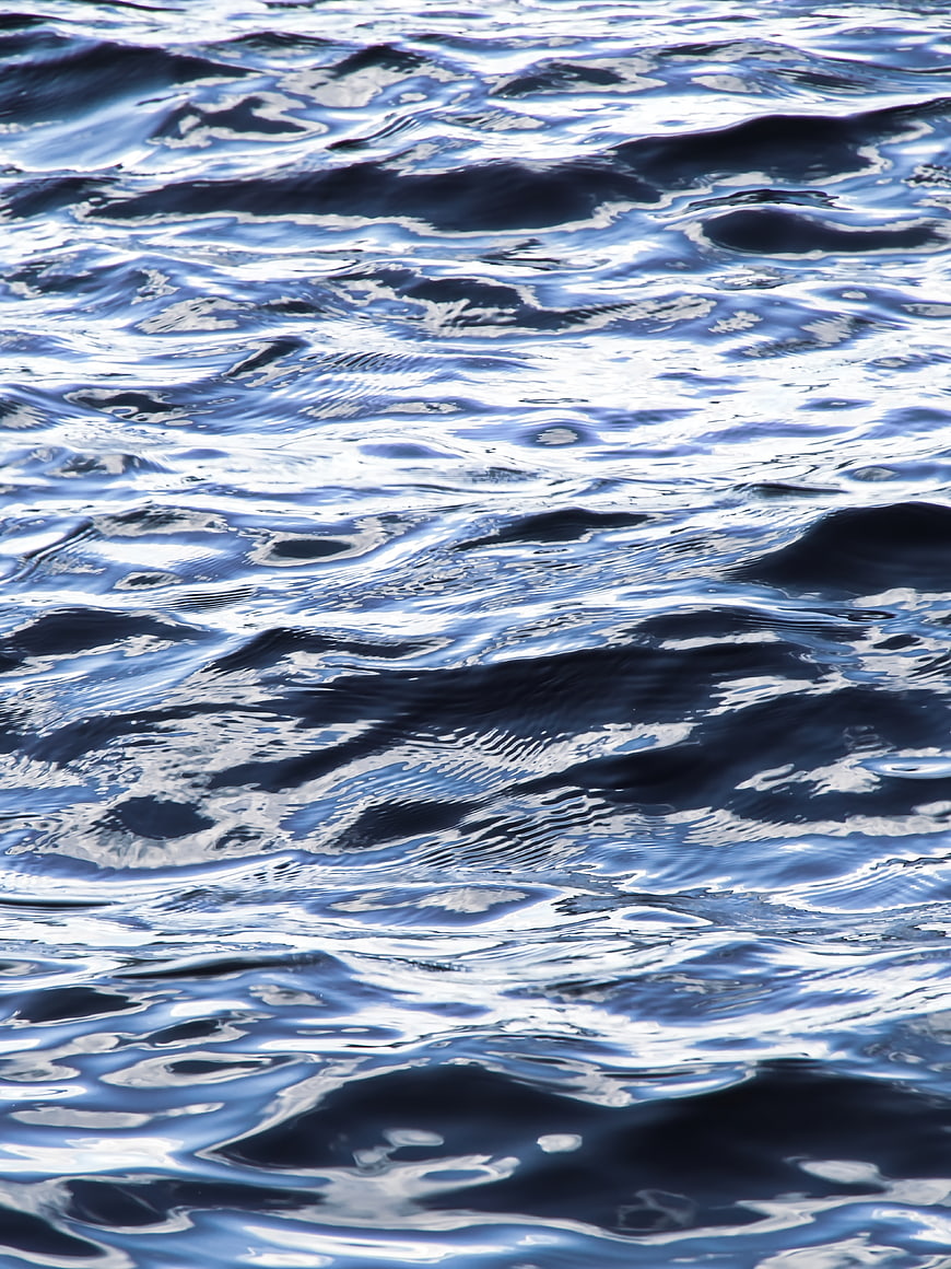 Close-up of rippling blue water surface with natural texture