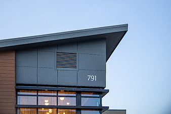 Modern House Exterior with Warm Interior Lighting