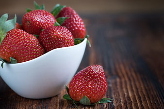 Fresh Strawberries in White Bowl on Wooden Table