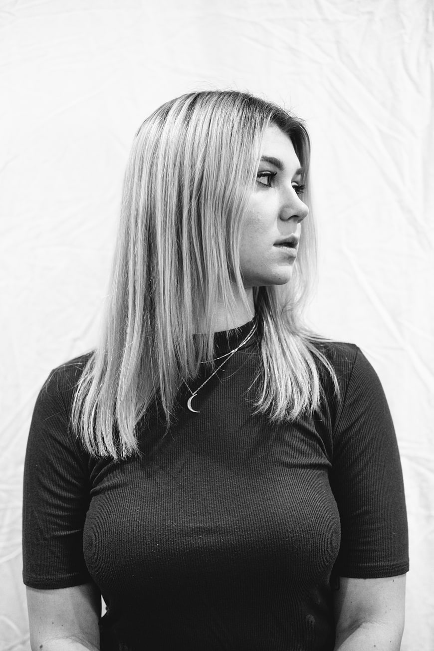 Black and white portrait of a young woman looking away