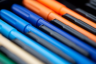 Close-up of colorful markers arranged diagonally