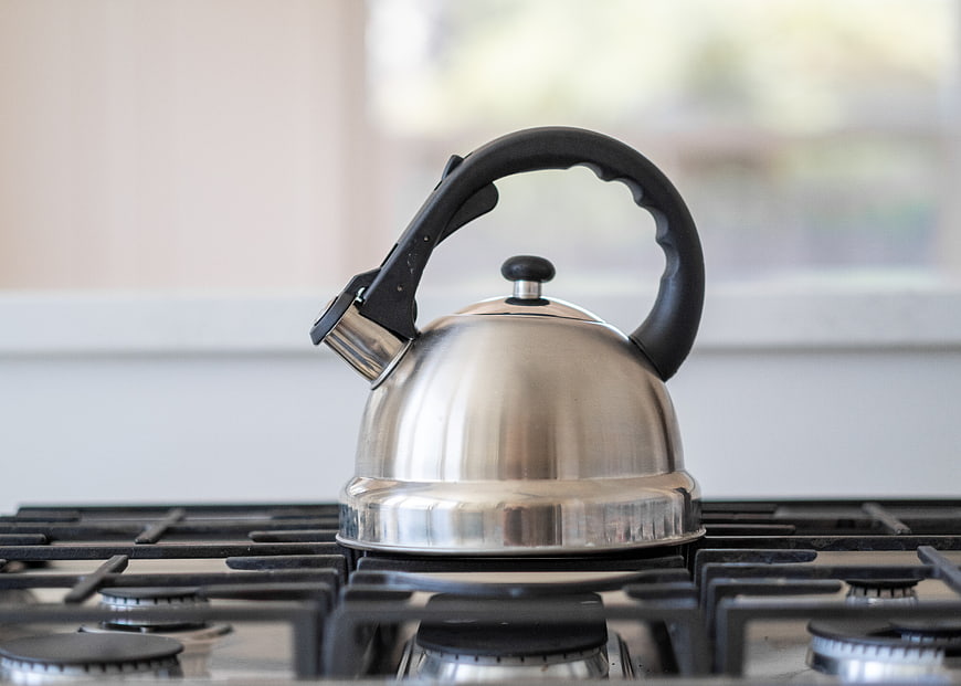 Stainless Steel Kettle on Gas Stove Top