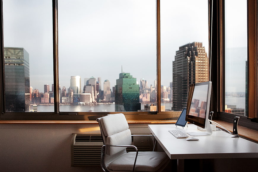 Modern office desk with city skyline view