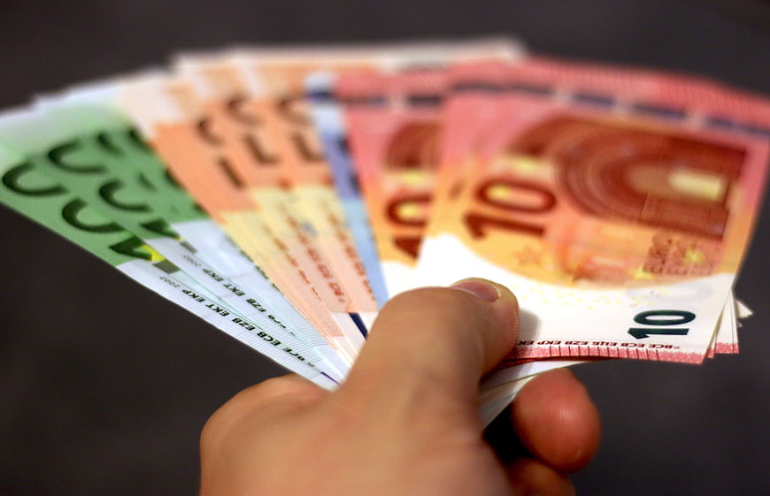 Hand Holding Fan of Euro Banknotes