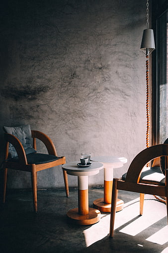 Minimalist Interior with Wooden Chairs and Concrete Wall