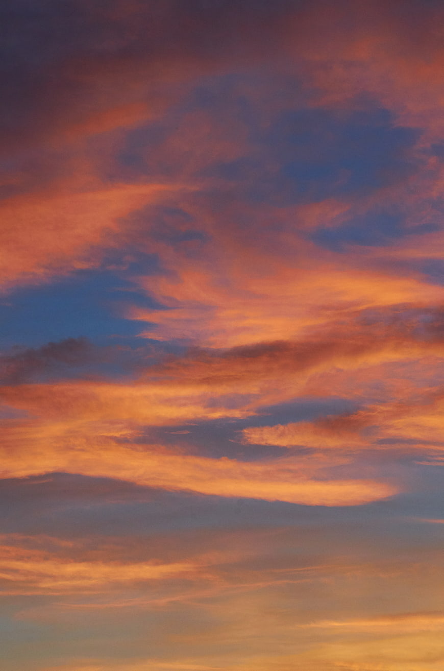Vibrant orange and blue sunset clouds sky background
