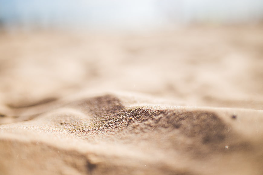 Close-up of textured sand dunes with shallow depth of field