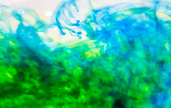 Abstract Blue and Green Ink Swirling in Water