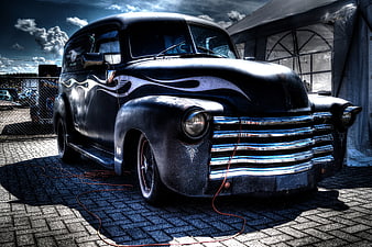 Vintage Black Rat Rod Truck with Flames and Chrome Grille