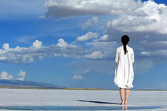 Woman in White Dress Standing on Salt Flat