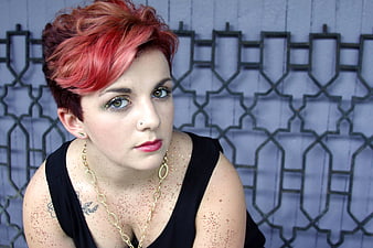 Portrait of woman with red hair and glitter makeup