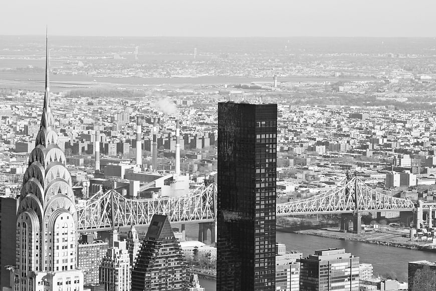 Black and white aerial view of New York City skyline with Chrysler Building
