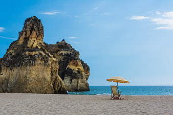 Lone Beach Chair and Umbrella by Coastal Cliffs