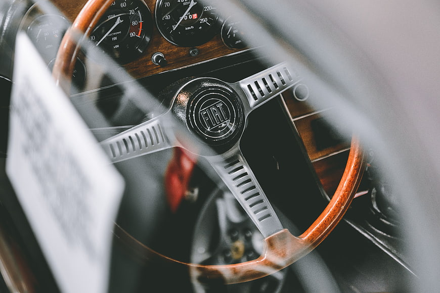 Vintage Fiat Steering Wheel and Dashboard Interior Close-Up