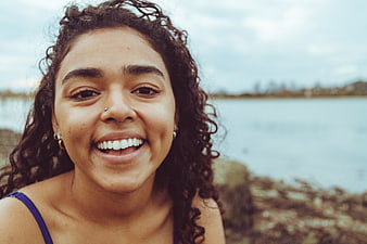 Happy Smiling Woman Portrait by the Lake